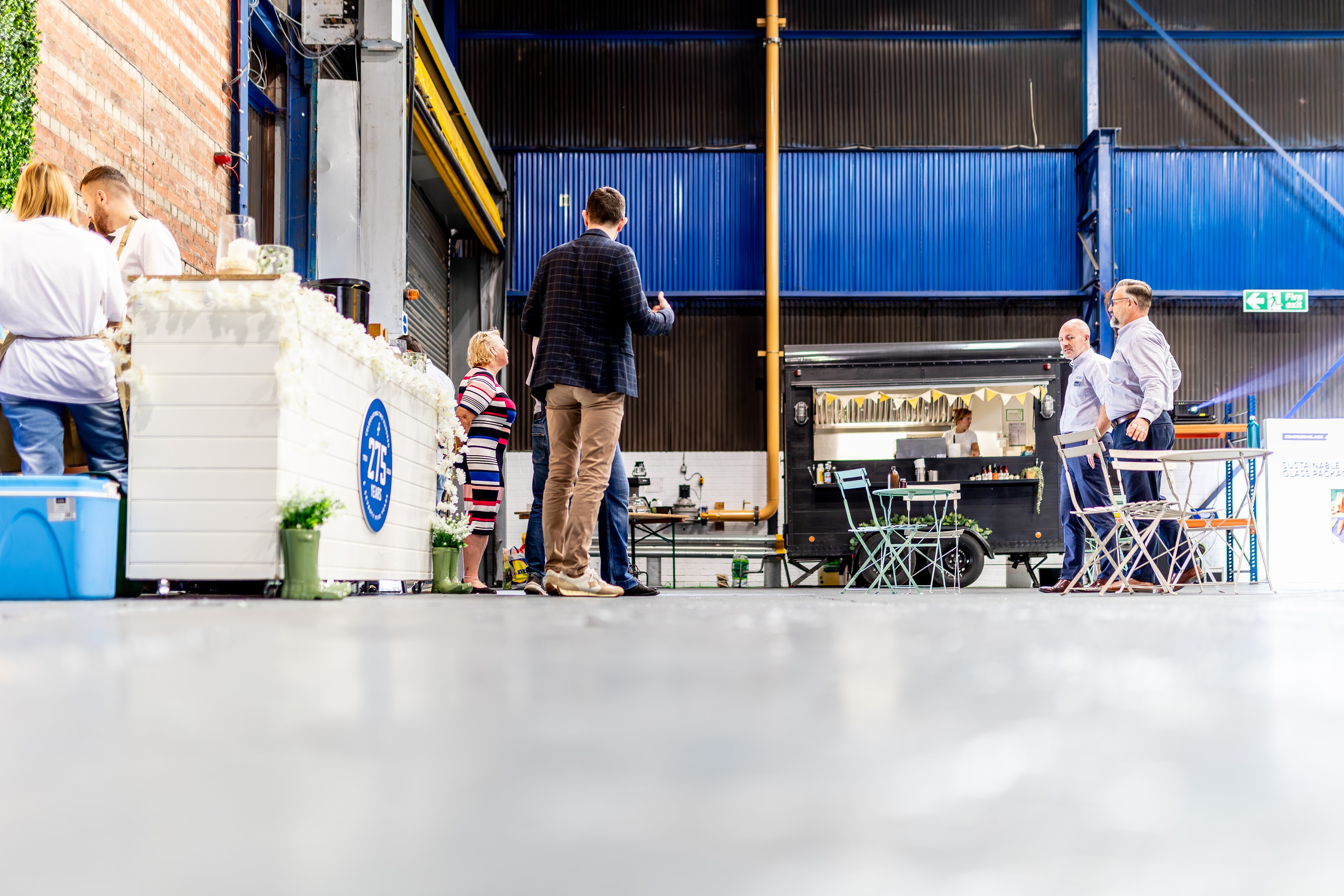 Bar 66 at a warehouse event with guests and mobile bar setup