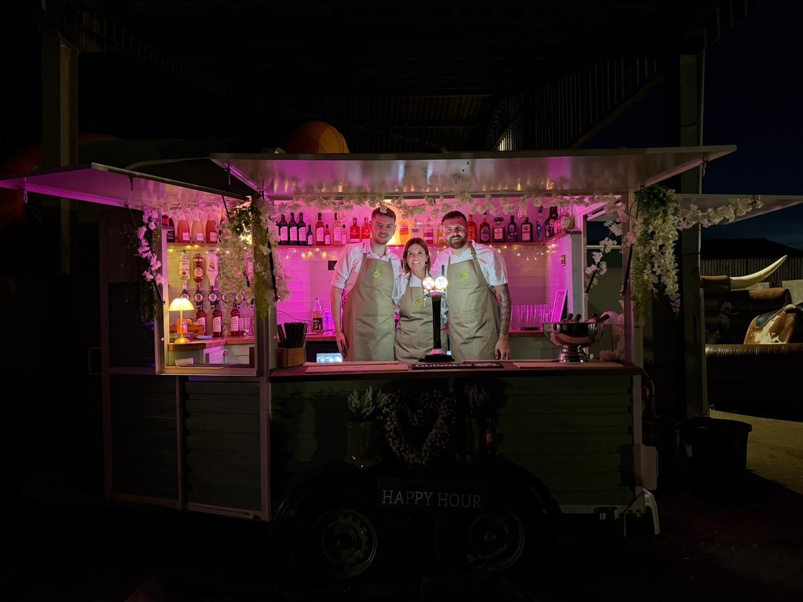 Bar 66 lit up at night with pink lighting at an event